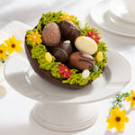 Produktbild fr 'Dekoratives Baumkuchen-Osternest mit feinsten Pralineneiern'